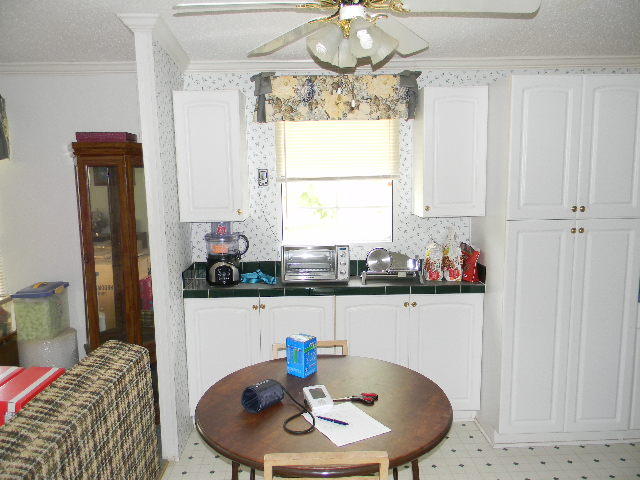 223 West Burnis Road Crestview, FL 32539 - Photo 32 of 49 a dining room with furniture and window