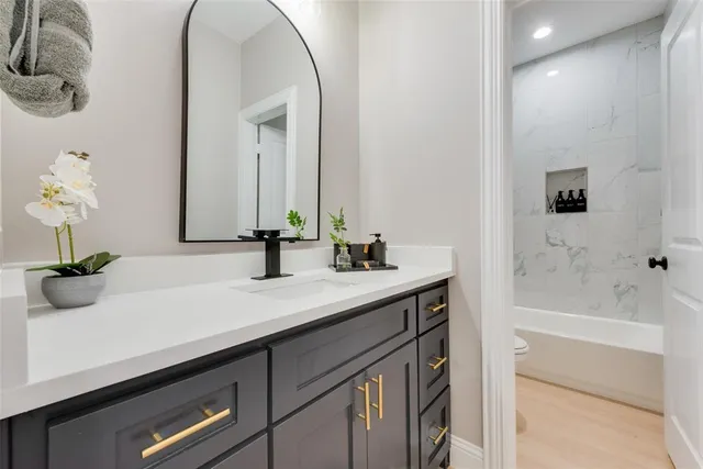 a bathroom with a sink and a bathtub