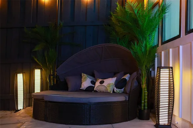 a view of patio with a table and chairs and a flower pot