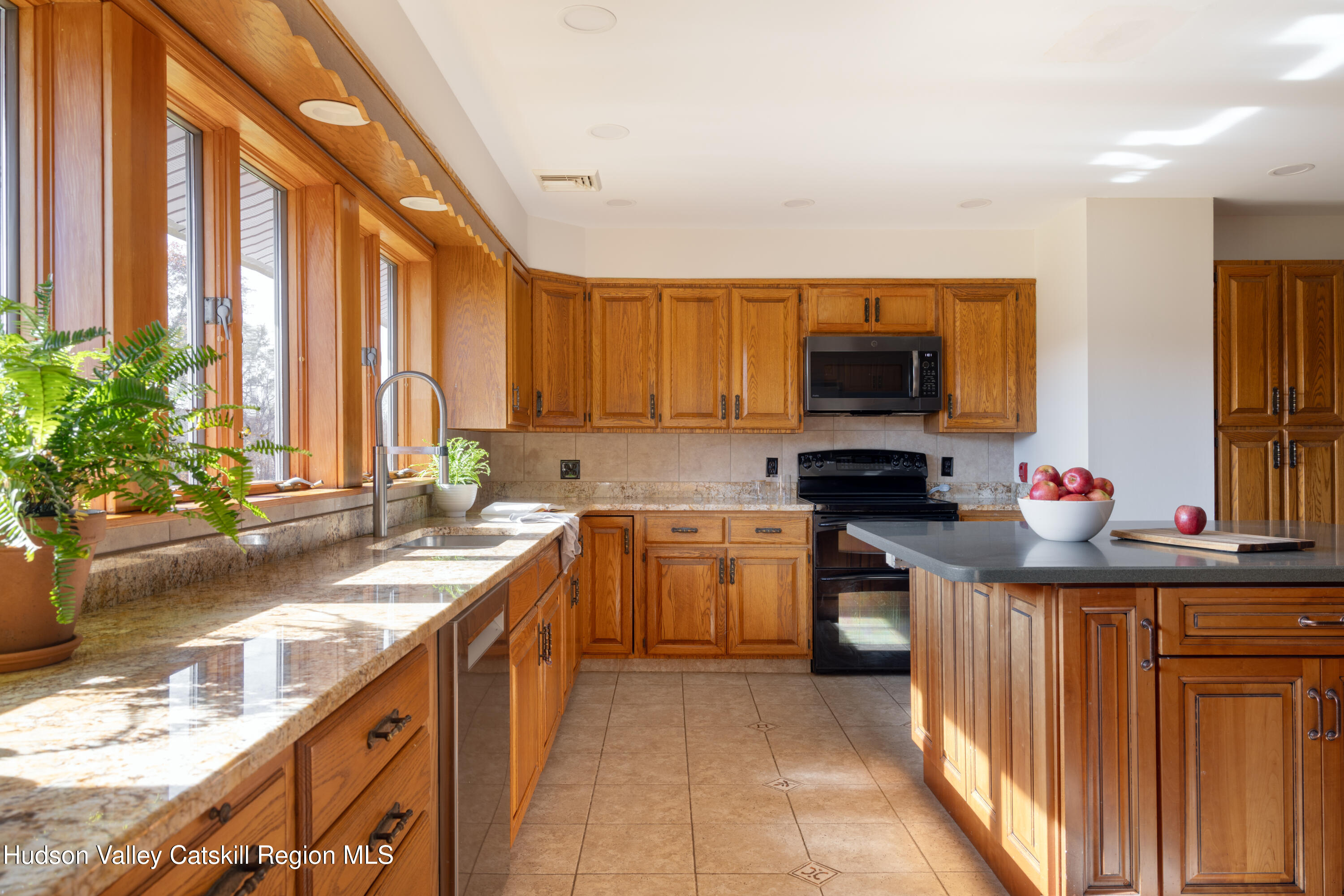370 Forest Road Wallkill, NY 12589 - Photo 11 of 33 a kitchen with a sink stove and cabinets