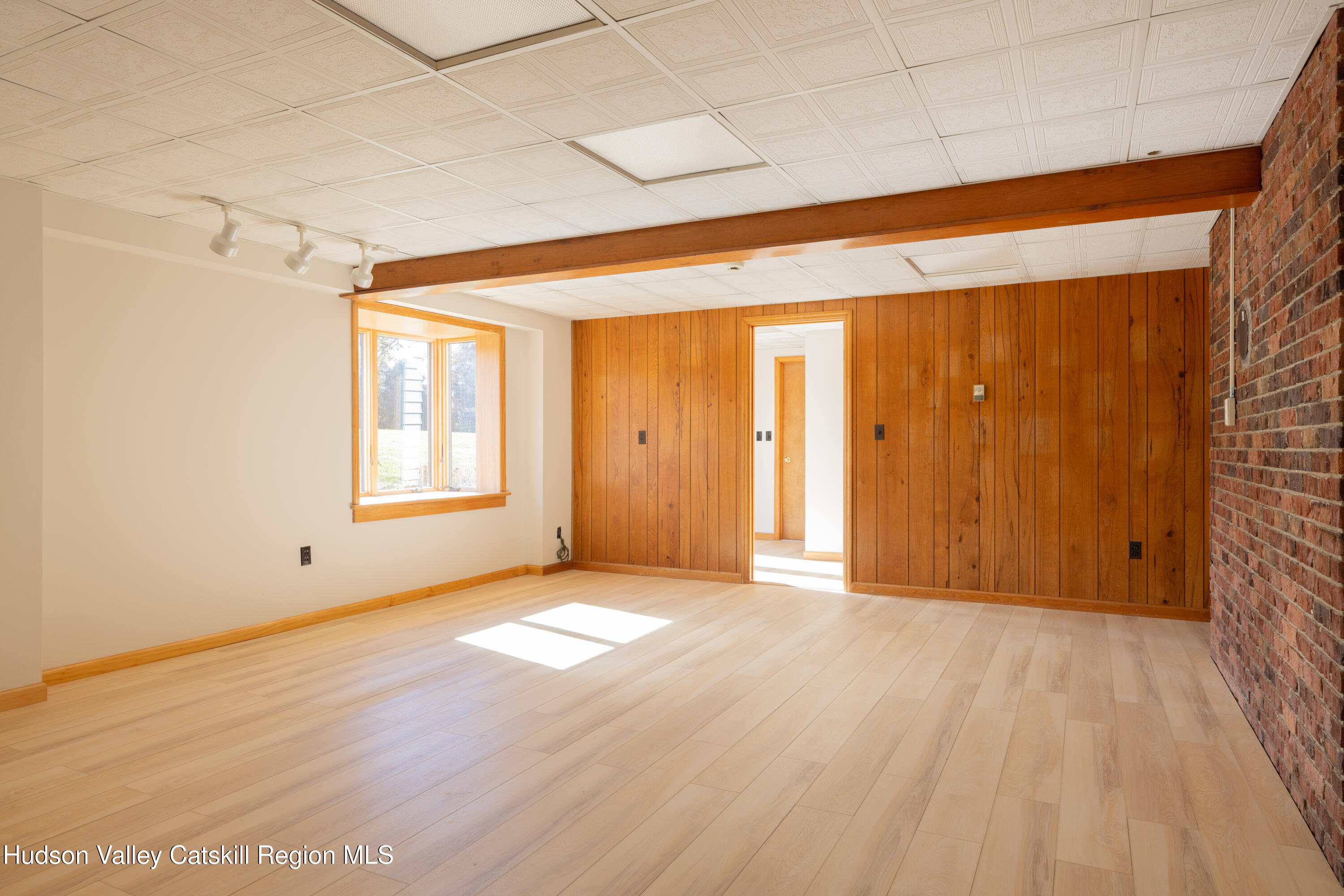 370 Forest Road Wallkill, NY 12589 - Photo 23 of 33 a view of an empty room with wooden floor and a window