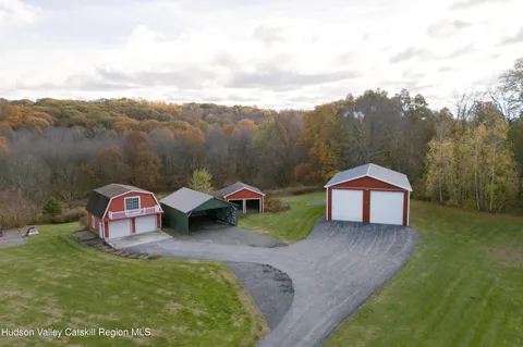 a wooden bench sitting in the middle of a field