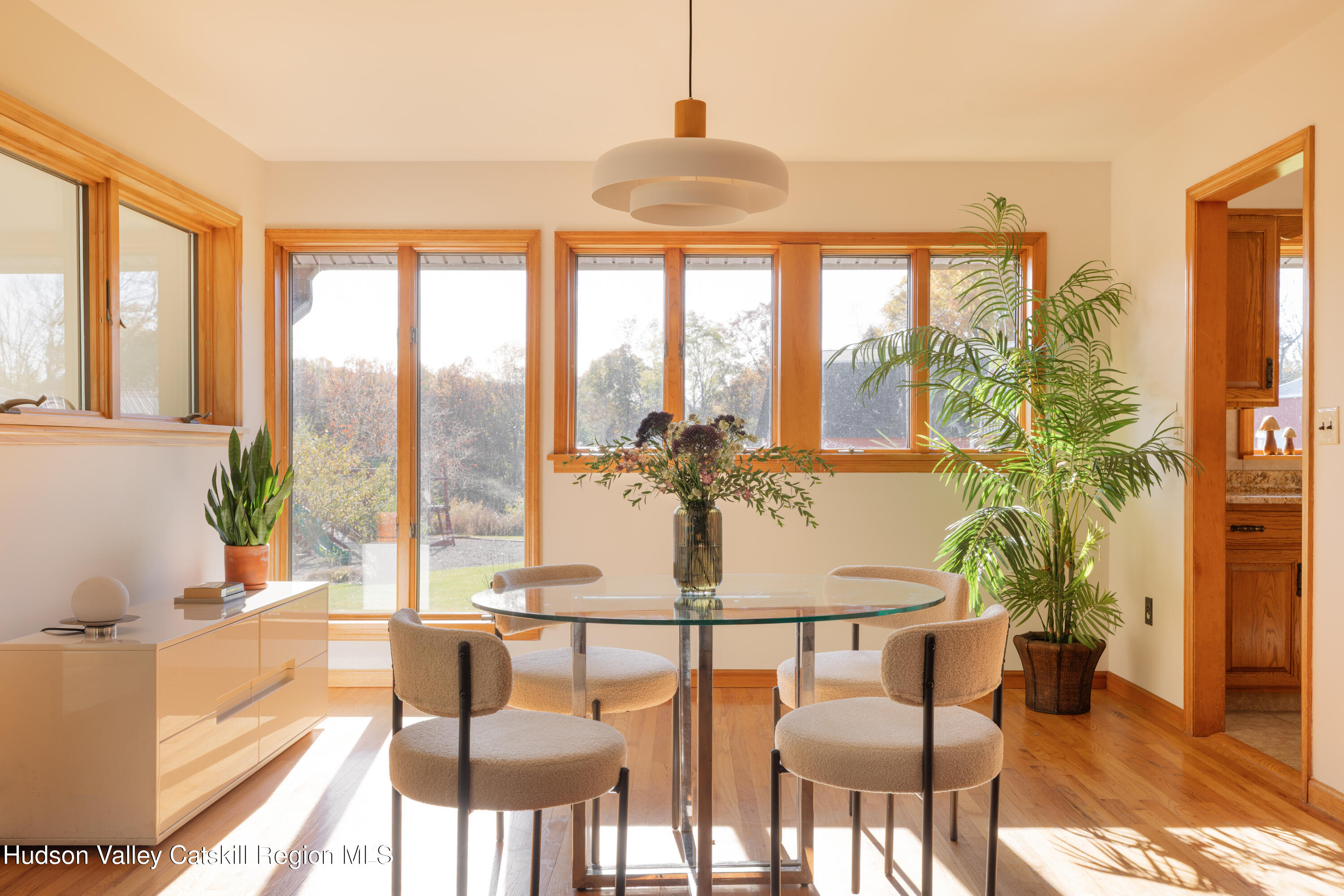 370 Forest Road Wallkill, NY 12589 - Photo 8 of 33 a view of a dining room with furniture large windows and wooden floor