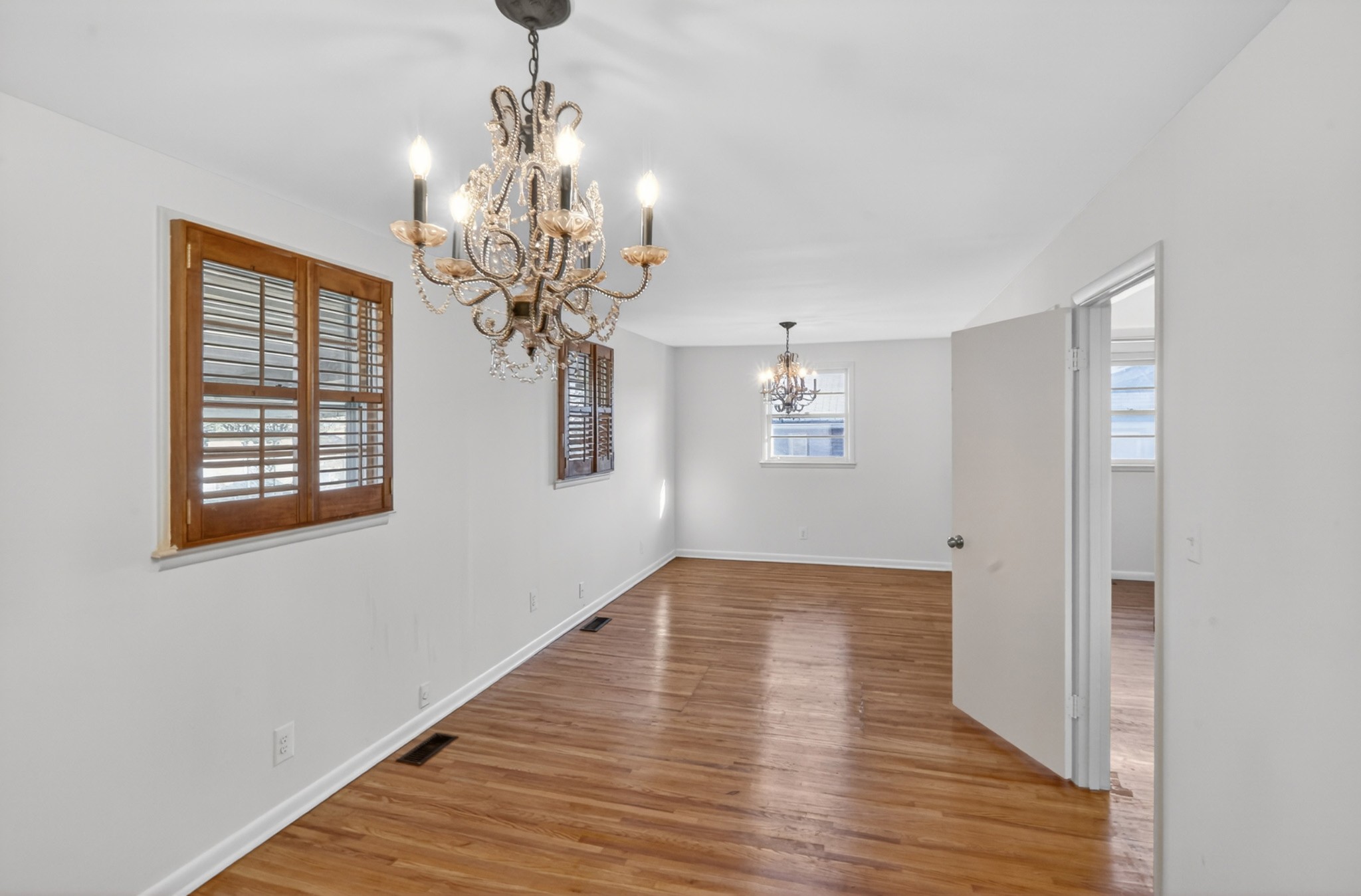 758 Moormans Arm Road Nashville, TN 37207 - Photo 18 of 35 a view of a chandelier in a room with wooden floor