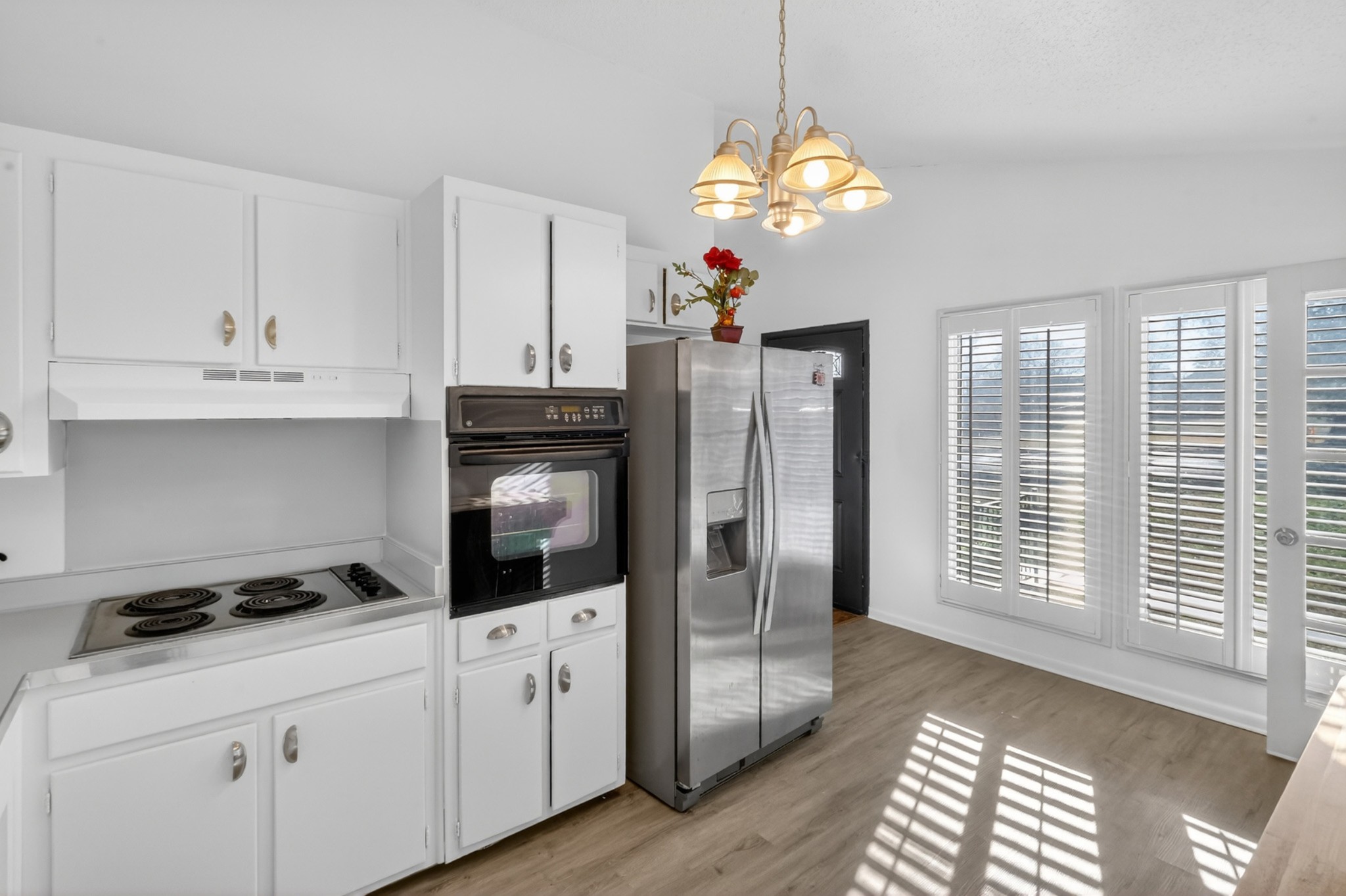 758 Moormans Arm Road Nashville, TN 37207 - Photo 10 of 35 a kitchen with stainless steel appliances granite countertop a stove a refrigerator and a white cabinets