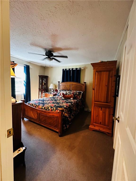 368 Dixon Road Demorest, GA 30535 - Photo 48 of 67 a bedroom with a large bed and a dresser