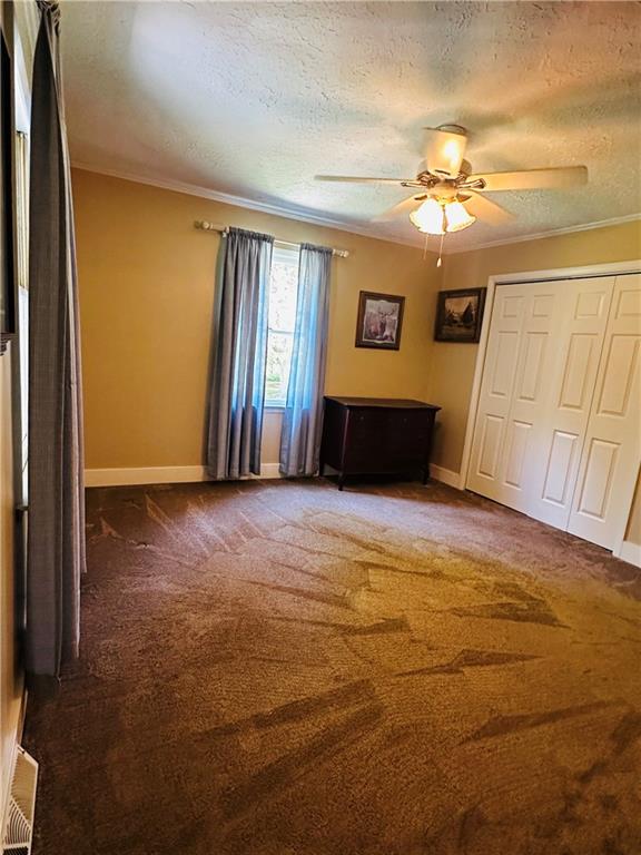 368 Dixon Road Demorest, GA 30535 - Photo 52 of 67 a view of a livingroom with wooden floor and a ceiling fan
