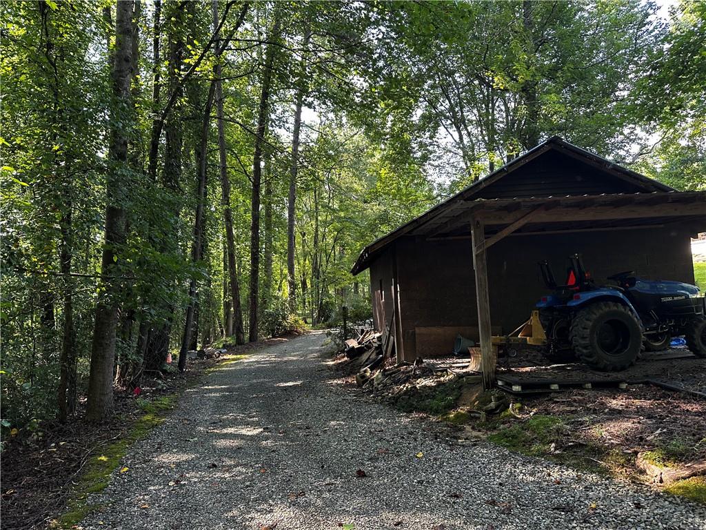 368 Dixon Road Demorest, GA 30535 - Photo 8 of 67 a view of a barn in the middle of a yard