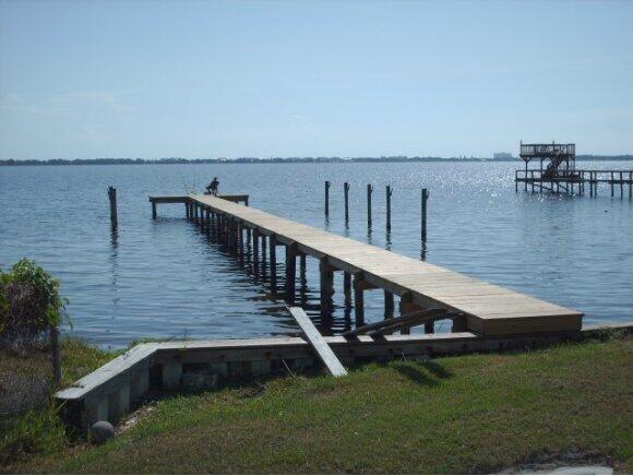 2221 Pineapple Avenue, Unit 2 Melbourne, FL 32935 - Photo 2 of 3 a view of a balcony with chairs