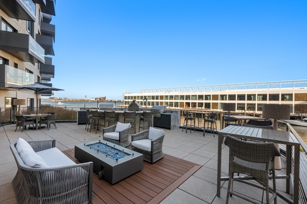 300 Pier 4 Blvd., Unit 7G Boston, MA 02210 - Photo 33 of 39 a view of a terrace with seating area and barbeque oven