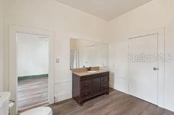 a room with a table and cabinets