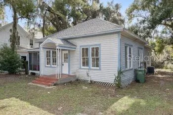 a backyard of a house with yard and barbeque oven