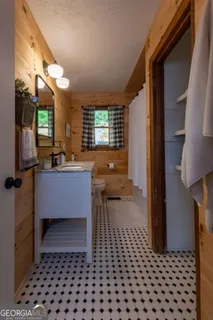an aerial view of a house with pool yard and outdoor seating