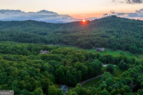 an aerial view of a house with mountain view