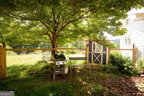 a aerial view of a house with table and chairs