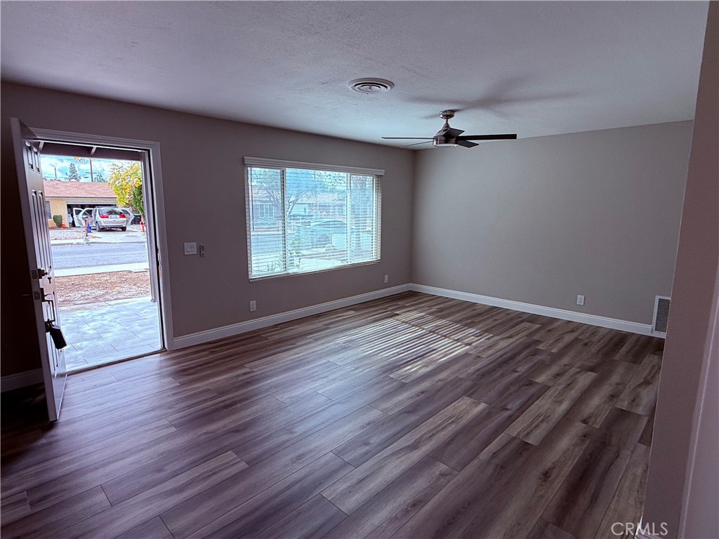596 Opal Avenue Hemet, CA 92543 - Photo 12 of 30 wooden floor in an empty room with a window