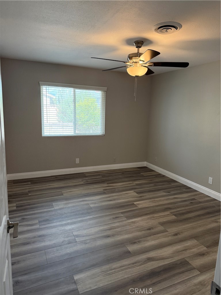 596 Opal Avenue Hemet, CA 92543 - Photo 13 of 30 a view of a room with wooden floor
