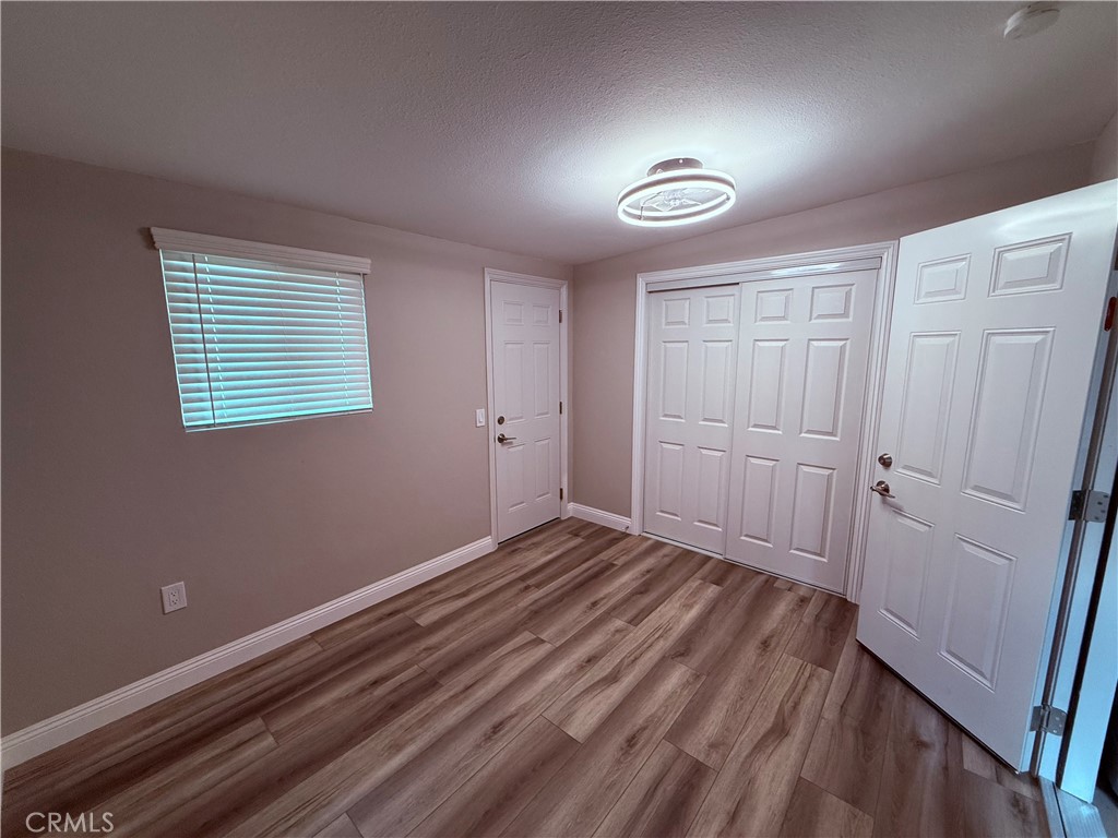 596 Opal Avenue Hemet, CA 92543 - Photo 20 of 30 a view of empty room with wooden floor