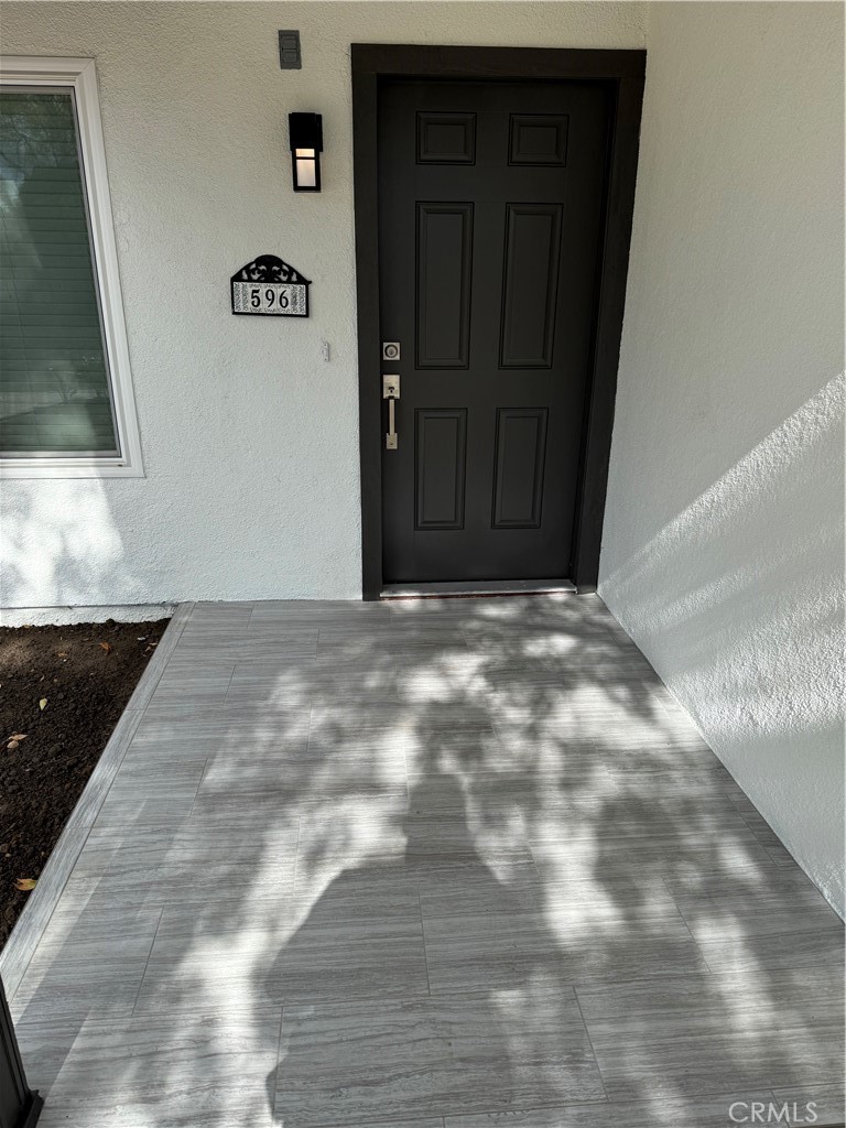 596 Opal Avenue Hemet, CA 92543 - Photo 4 of 30 a view of a livingroom with wooden floor