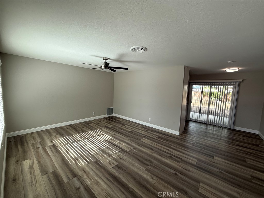 596 Opal Avenue Hemet, CA 92543 - Photo 6 of 30 wooden floor in an empty room with a window