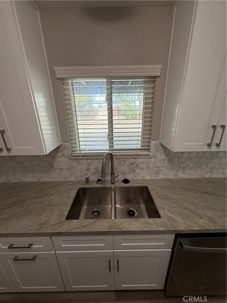 596 Opal Avenue Hemet, CA 92543 - Photo 9 of 30 a bathroom with a sink and a bathtub