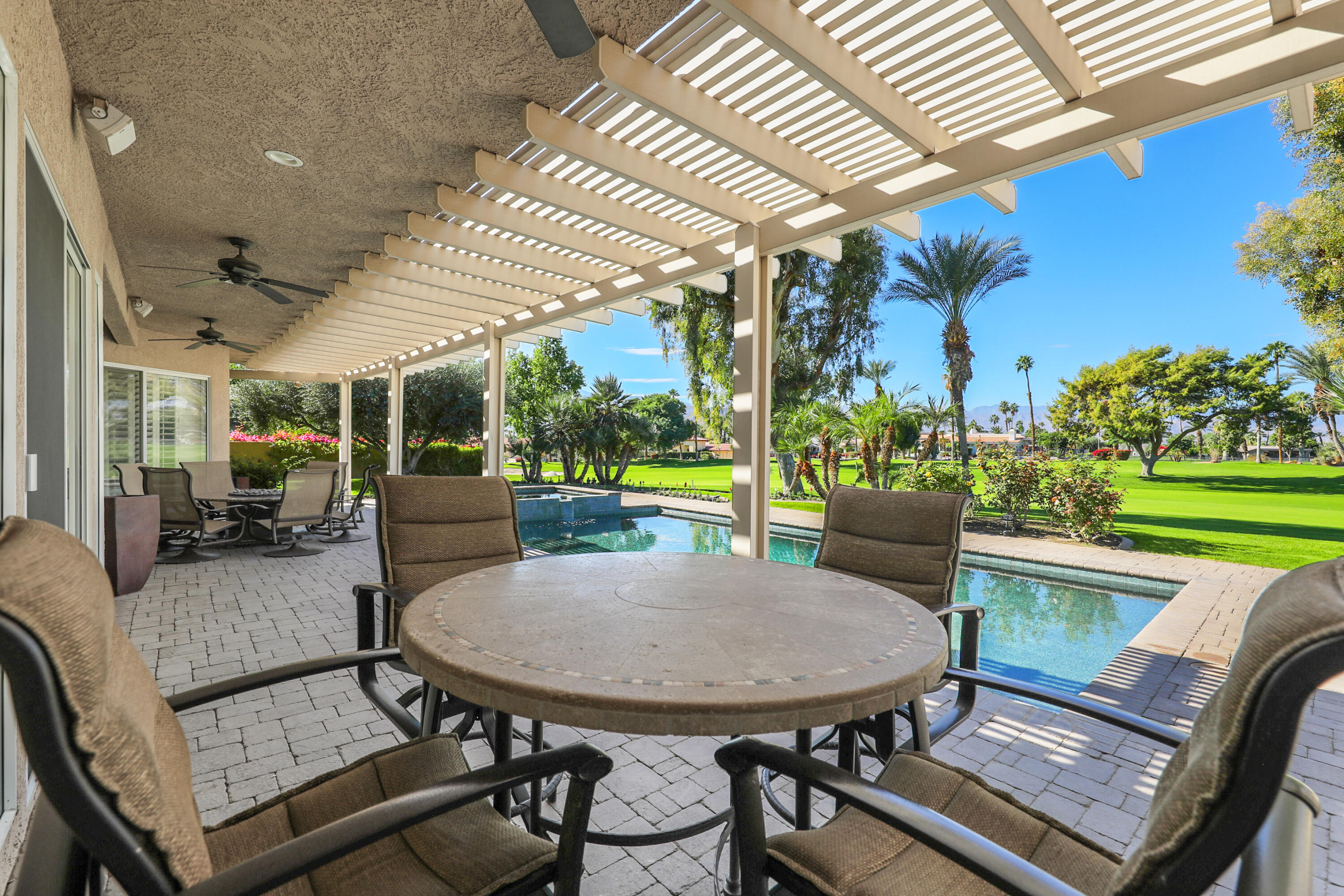 43651 Port Maria Road Bermuda Dunes, CA 92203 - Photo 33 of 46 a view of a patio with a table and chairs