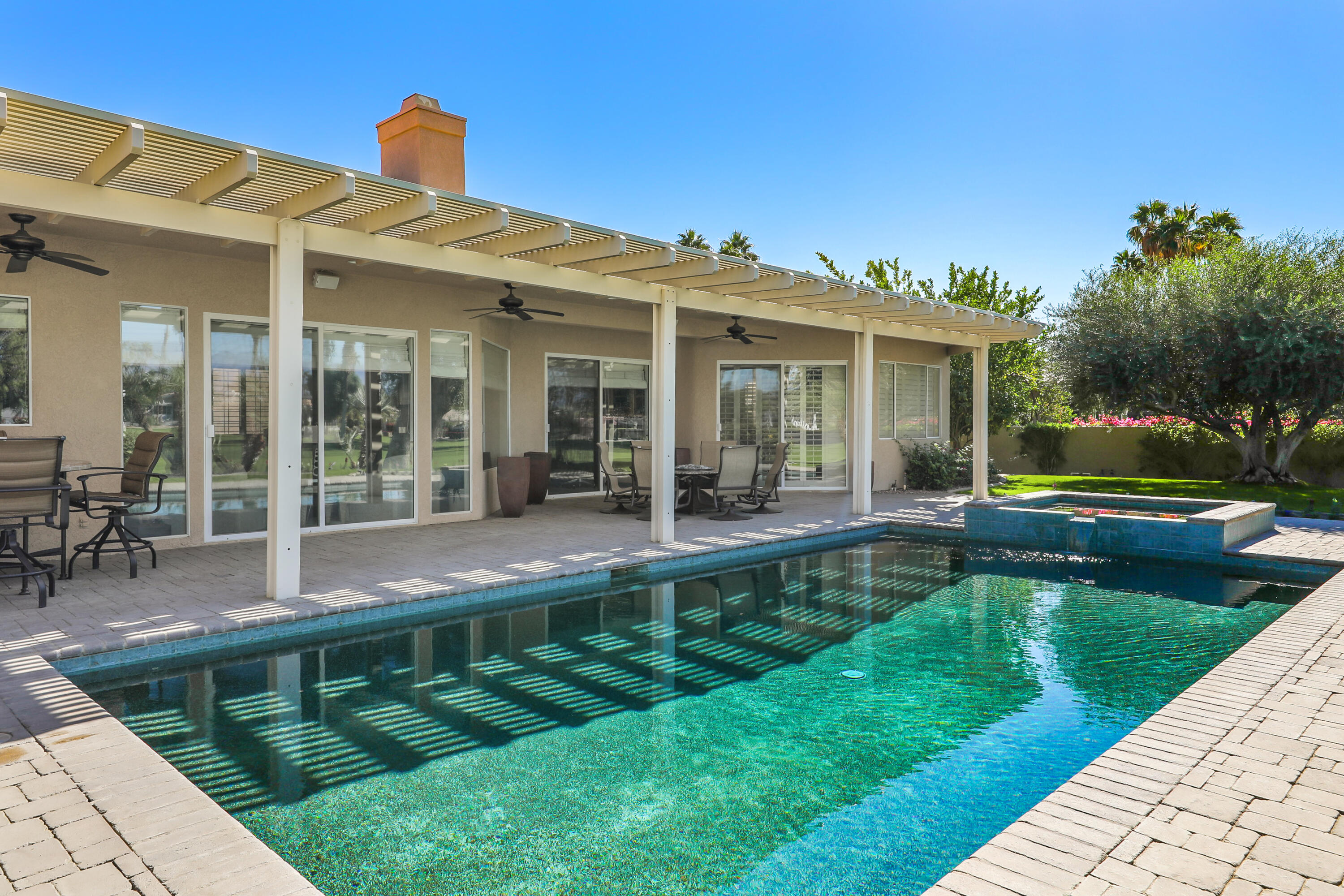 43651 Port Maria Road Bermuda Dunes, CA 92203 - Photo 36 of 46 a view of a house with a backyard porch and sitting area