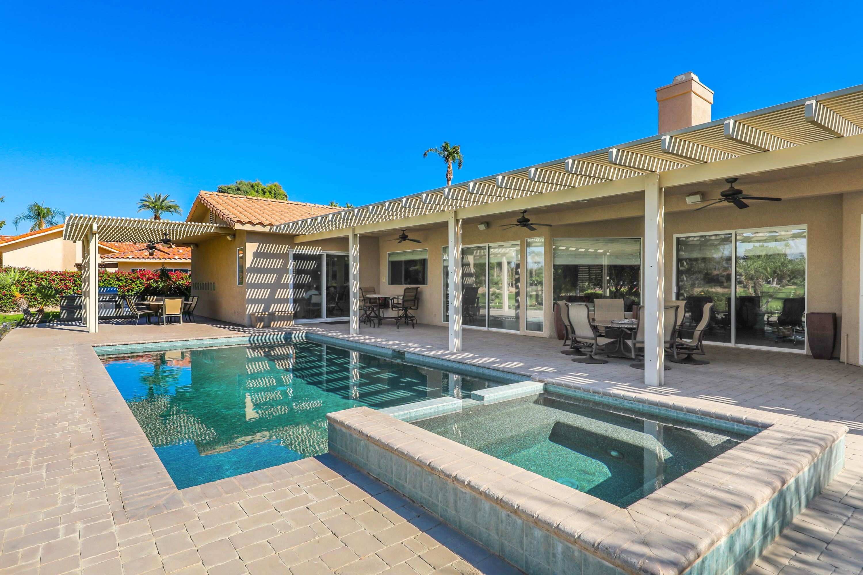43651 Port Maria Road Bermuda Dunes, CA 92203 - Photo 37 of 46 a view of a house with swimming pool and porch