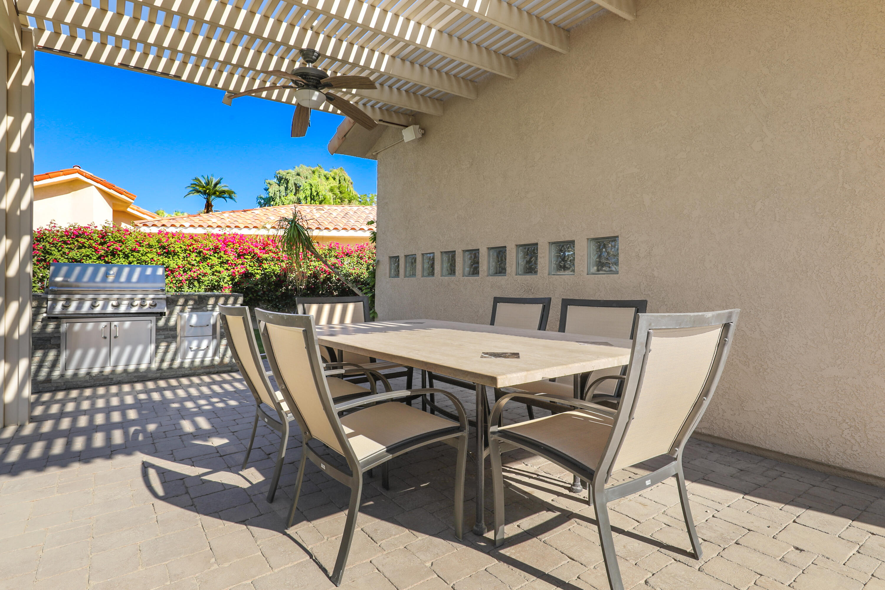 43651 Port Maria Road Bermuda Dunes, CA 92203 - Photo 42 of 46 a view of a patio with table and chairs with wooden floor