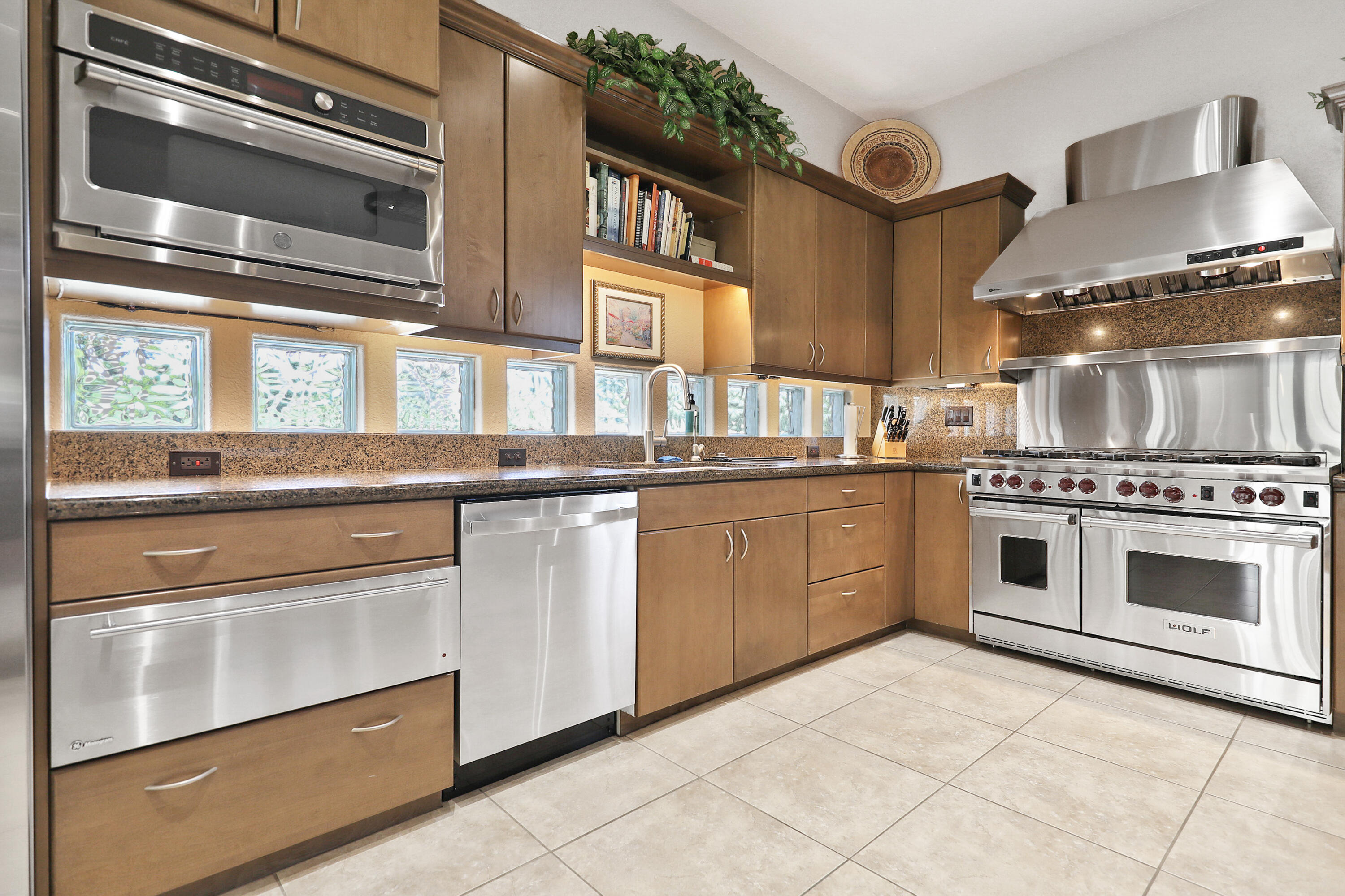 43651 Port Maria Road Bermuda Dunes, CA 92203 - Photo 8 of 46 a kitchen with stainless steel appliances granite countertop a stove and a sink