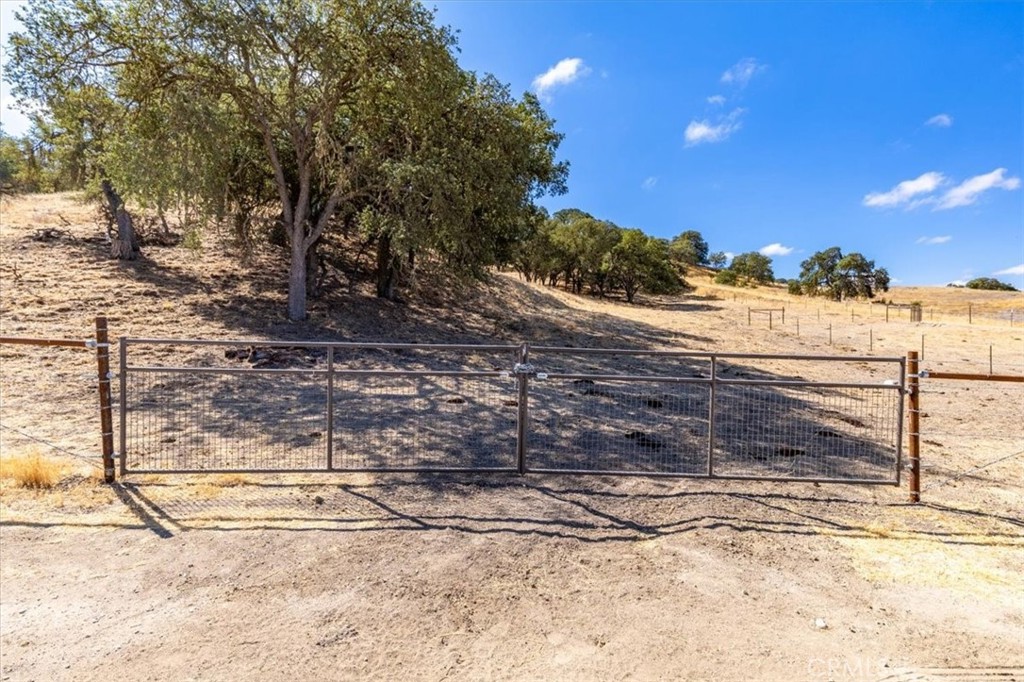 77599 Lowes Canyon Road San Miguel, CA 93451 - Photo 26 of 66 a view of a yard with wooden fence