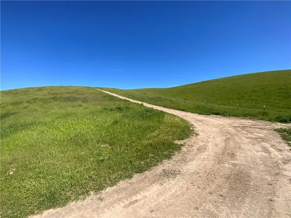 an aerial view of mountain with yard