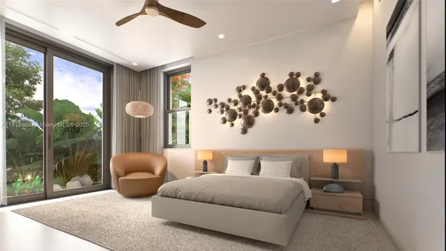 a bedroom with furniture and a large window