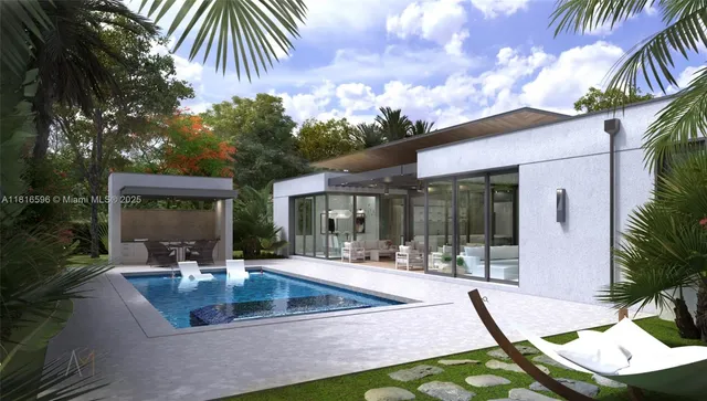 a view of a house with backyard and sitting area