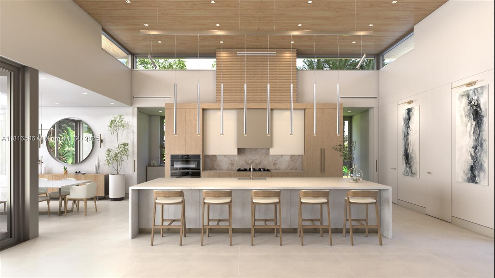 7605 Southwest 134th Street Pinecrest, FL 33156 - Photo 8 of 12 a large kitchen with a table and chairs