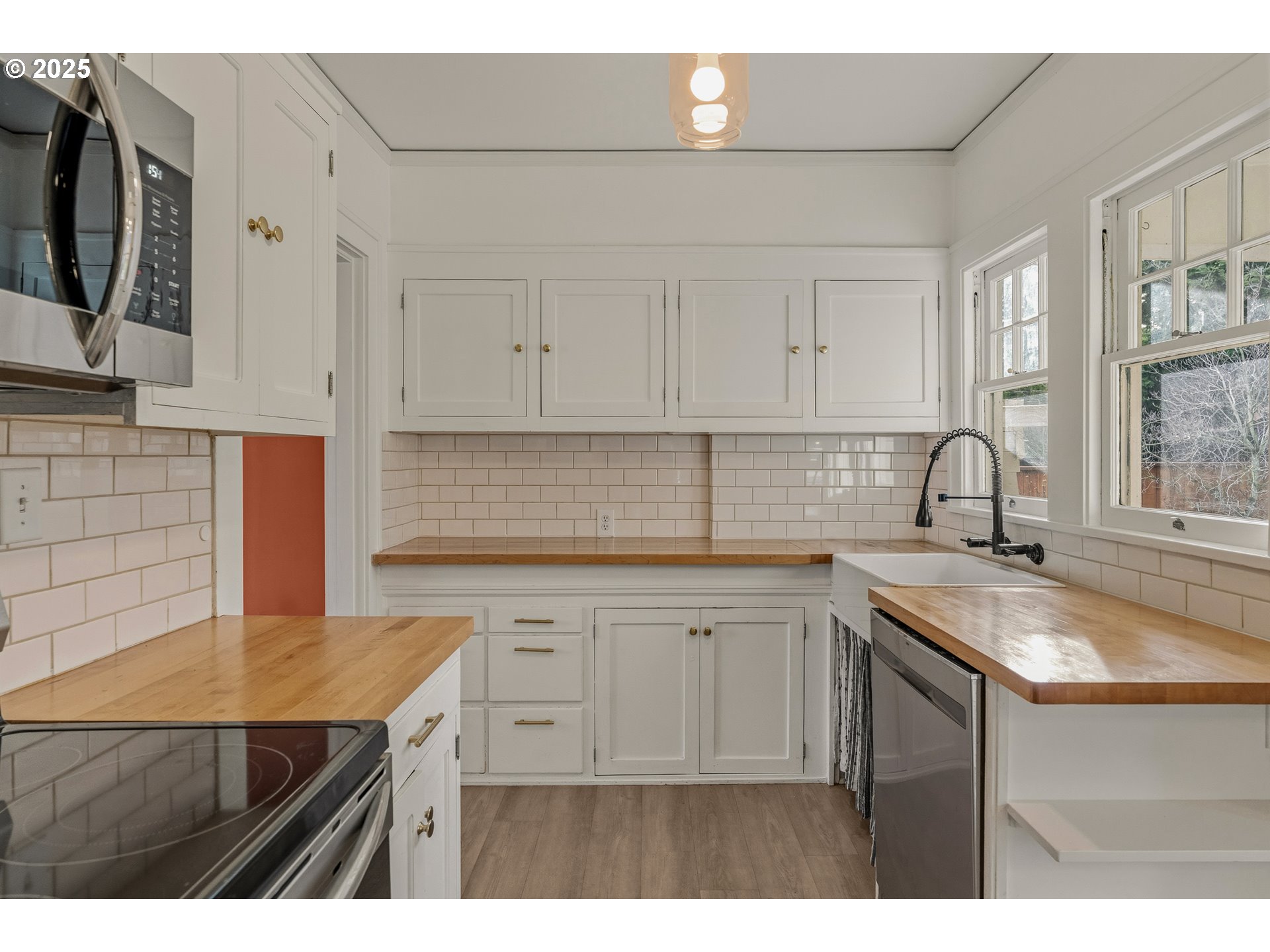 1825 Northeast 53rd Avenue Portland, OR 97213 - Photo 12 of 41 a kitchen with stainless steel appliances granite countertop a sink stove and cabinets