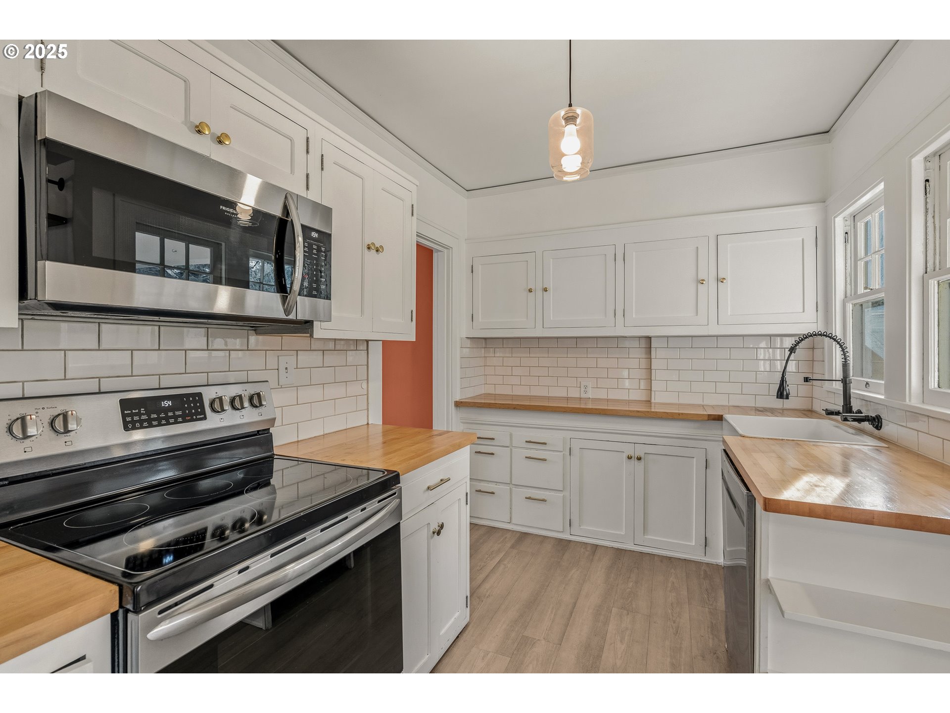 1825 Northeast 53rd Avenue Portland, OR 97213 - Photo 13 of 41 a kitchen with stainless steel appliances white cabinets and a sink