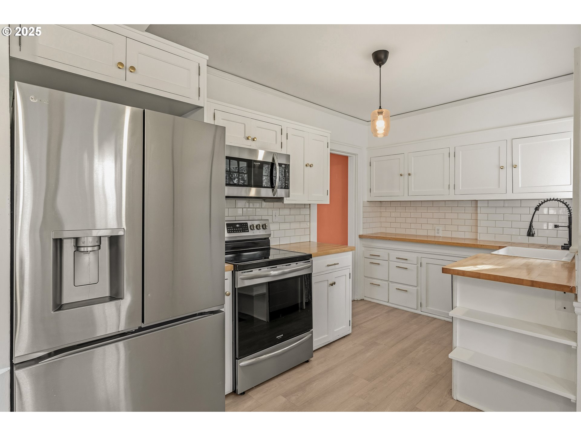 1825 Northeast 53rd Avenue Portland, OR 97213 - Photo 14 of 41 a kitchen with stainless steel appliances a refrigerator sink and microwave