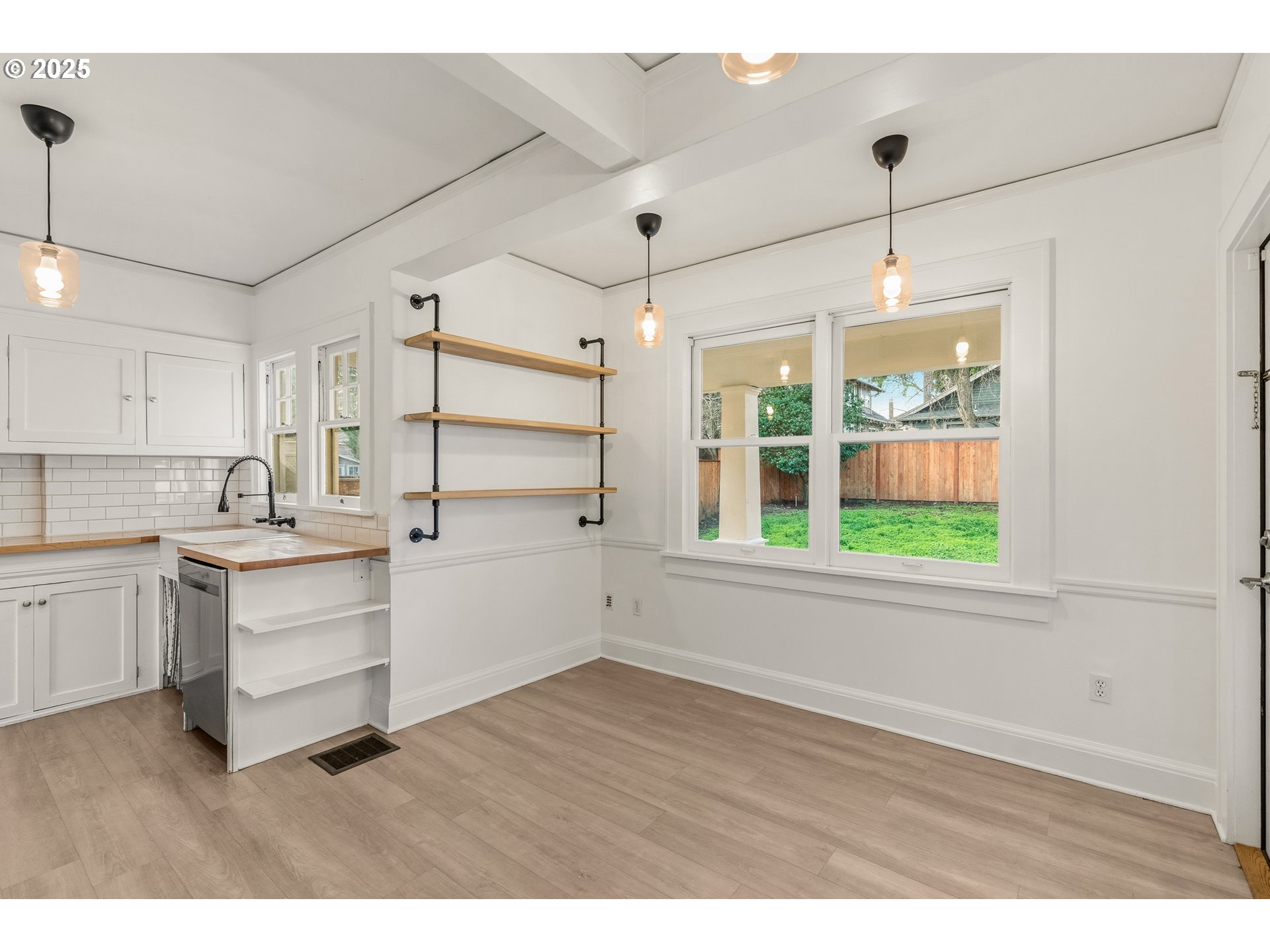1825 Northeast 53rd Avenue Portland, OR 97213 - Photo 16 of 41 a kitchen with a wooden floor and window