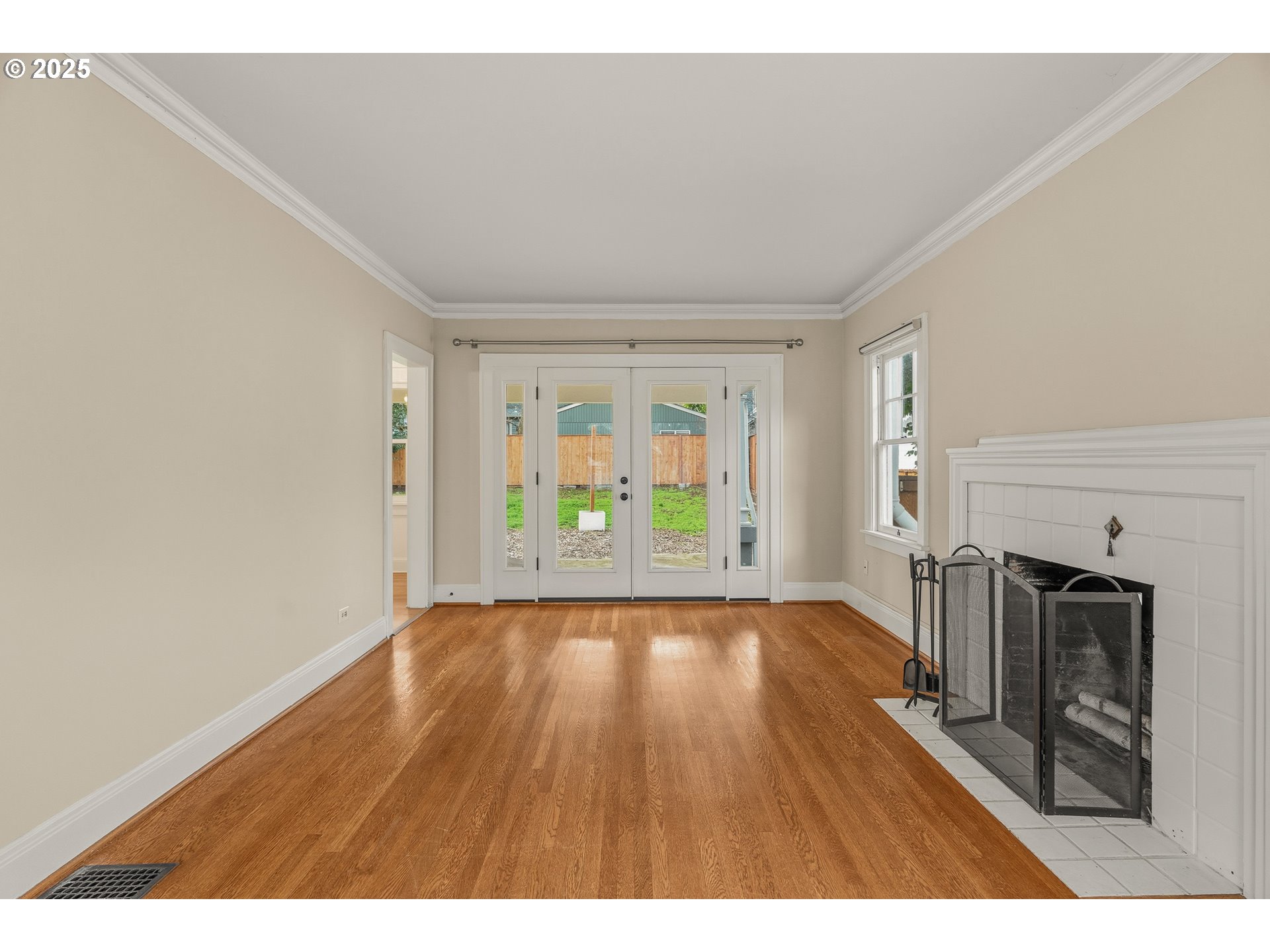 1825 Northeast 53rd Avenue Portland, OR 97213 - Photo 6 of 41 a view of an empty room with a window and wooden floor