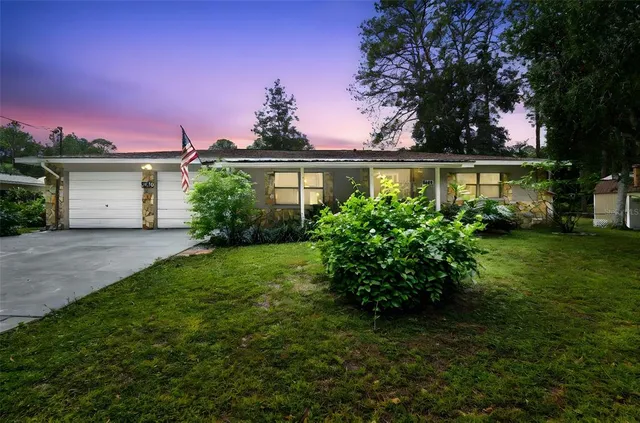 front view of a house with a yard