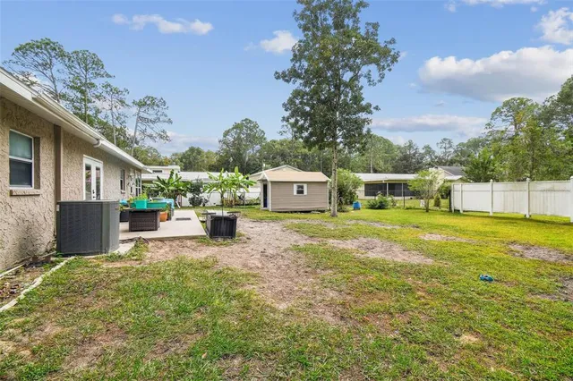 a view of a house with a yard porch and sitting area