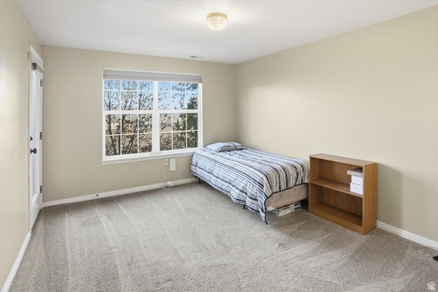 14820 175 East Draper, UT 84020 - Photo 19 of 39 Bedroom with light carpet and baseboards
