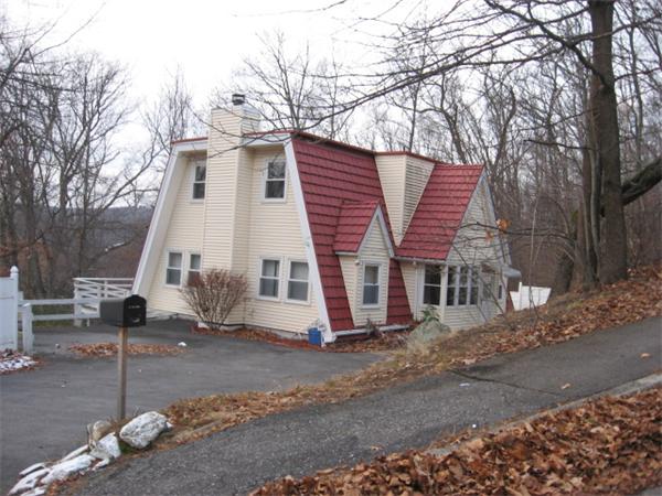 121 Copperfield Road Worcester, MA 01602 - Photo 1 of 18 a view of a white house with a large tree