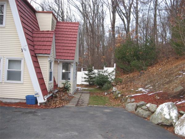 121 Copperfield Road Worcester, MA 01602 - Photo 15 of 18 a view of a house with a yard and garage