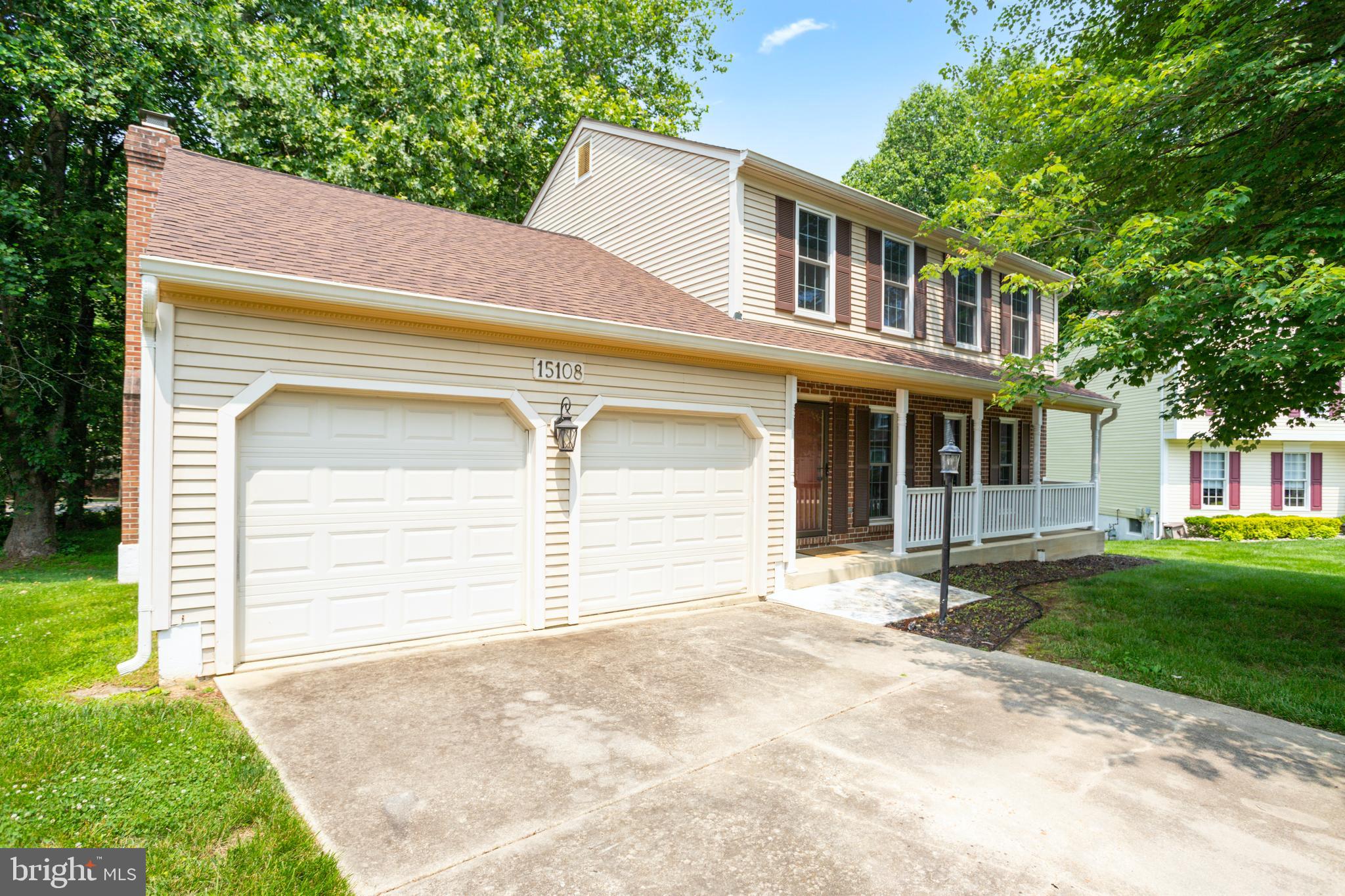 15108 Plum Tree Way Bowie, MD 20721 - Photo 1 of 51 a front view of a house with a yard and garage