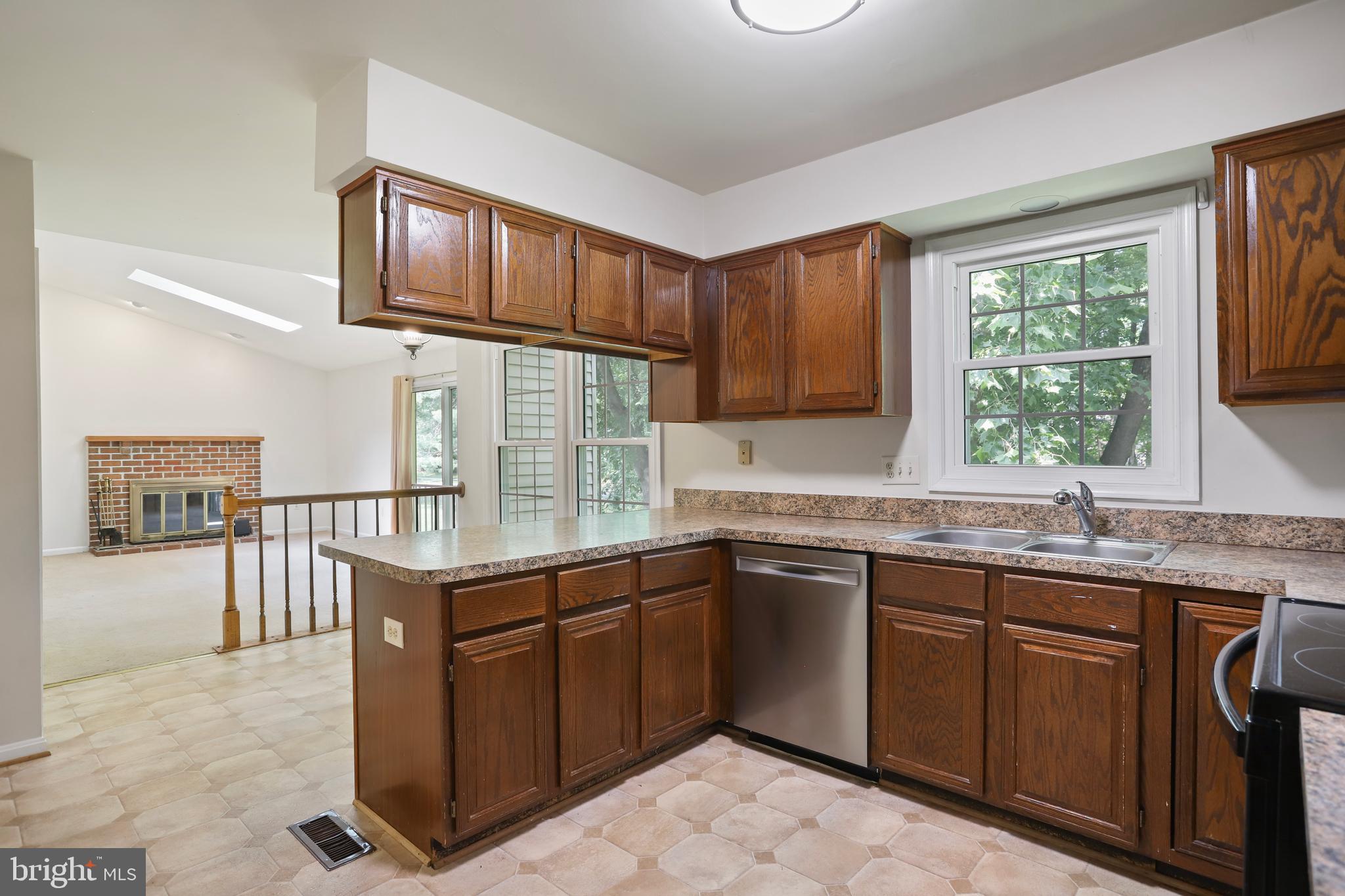 15108 Plum Tree Way Bowie, MD 20721 - Photo 15 of 51 a kitchen with a sink stove and cabinets
