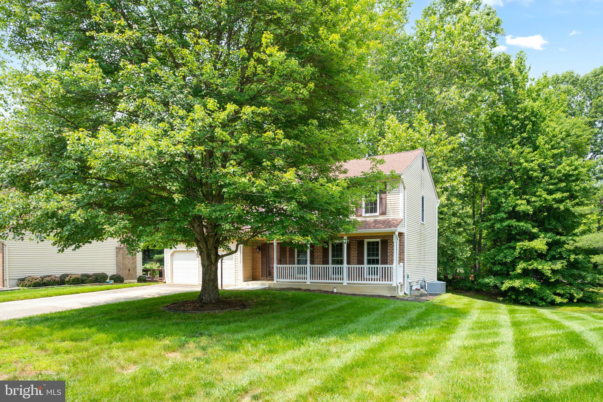 15108 Plum Tree Way Bowie, MD 20721 - Photo 3 of 51 a front view of a house with a garden