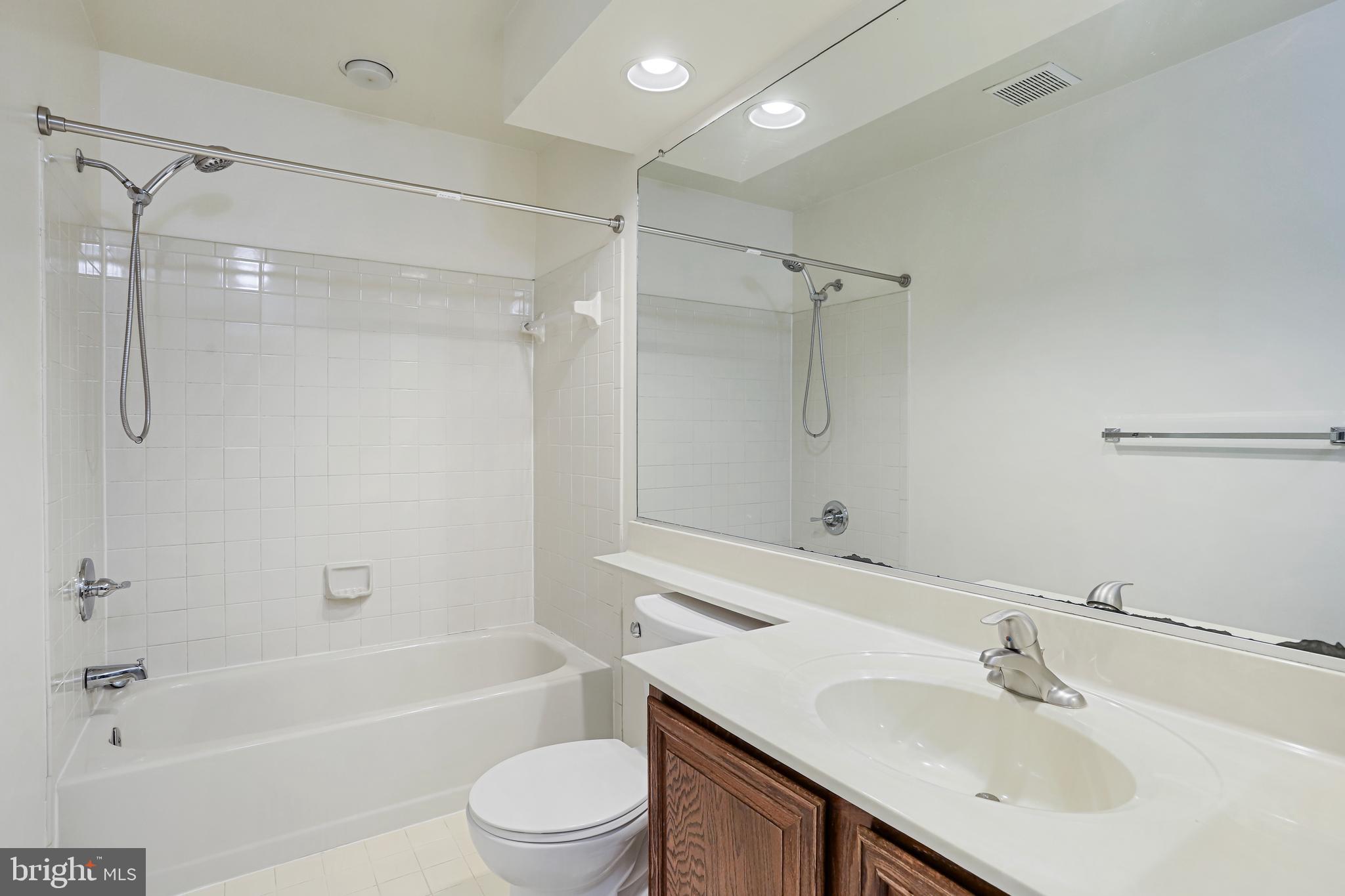 15108 Plum Tree Way Bowie, MD 20721 - Photo 42 of 51 a bathroom with a sink toilet and shower