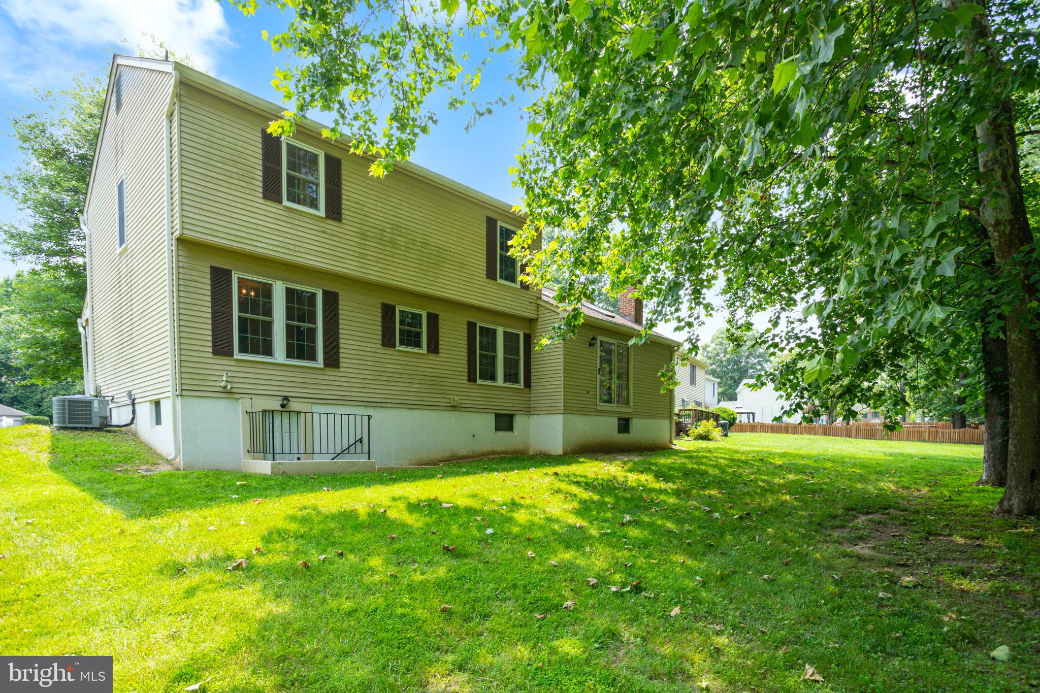 15108 Plum Tree Way Bowie, MD 20721 - Photo 5 of 51 a front view of a house with a yard